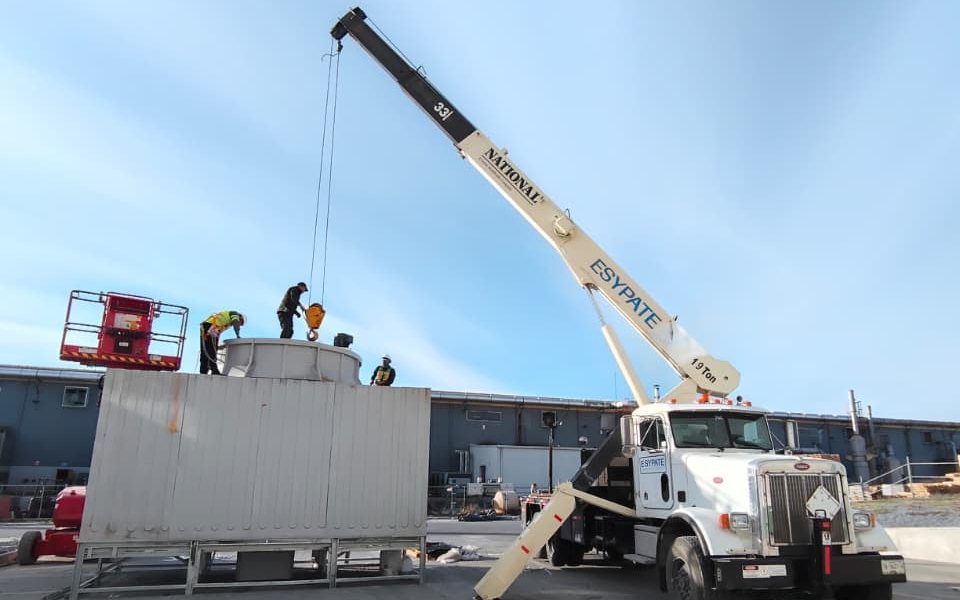 ESYPATE 19 T Titan crane lifting equipment onto a cooling tower